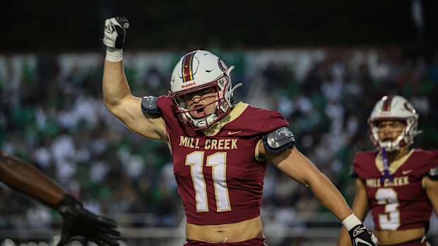 Mill Creek's Luke Mentz (11) celebrates a defensive stop against Buford as Trajen Greco looks on. 11/13/2023